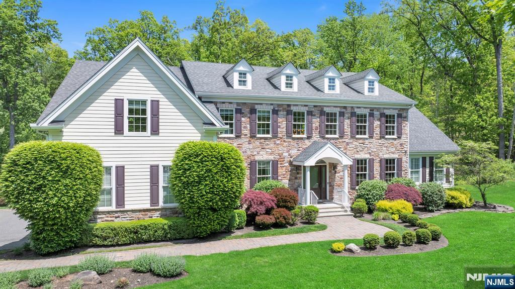 28 Arbor Road North Caldwell, NJ 07006 - Photo 3 of 50 a front view of a house with garden