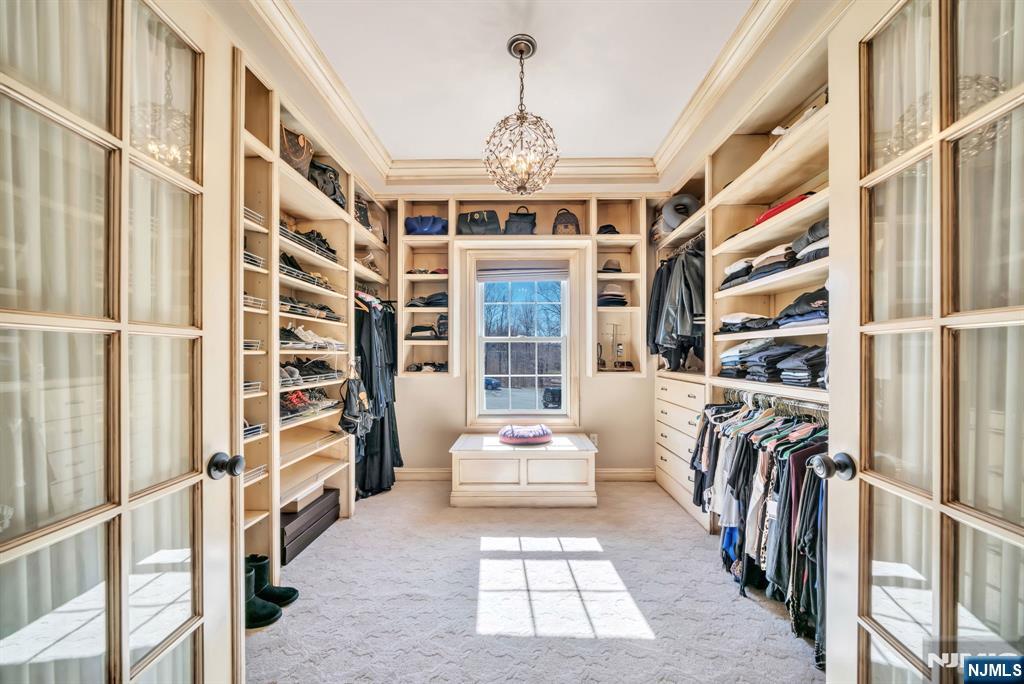 28 Arbor Road North Caldwell, NJ 07006 - Photo 32 of 50 a hallway with a couch and a large window