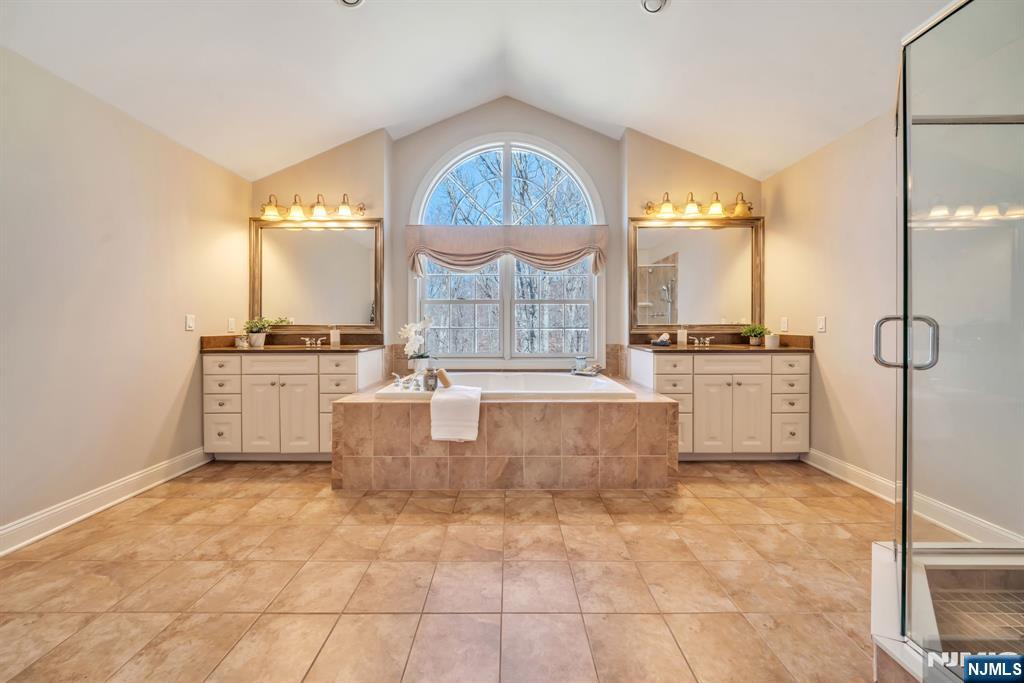 28 Arbor Road North Caldwell, NJ 07006 - Photo 35 of 50 a large kitchen with granite countertop a stove a sink and a refrigerator