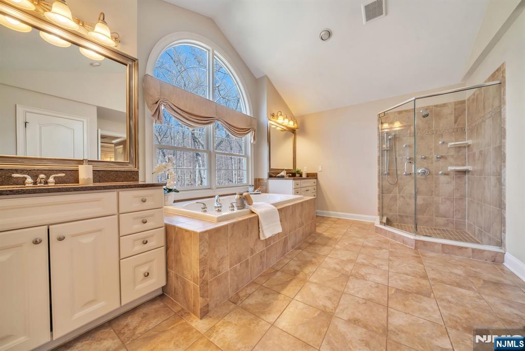 28 Arbor Road North Caldwell, NJ 07006 - Photo 36 of 50 a large bathroom with a double vanity sink a mirror and a shower