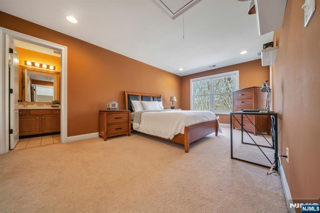 28 Arbor Road North Caldwell, NJ 07006 - Photo 37 of 50 a spacious bedroom with a bed and cabinets