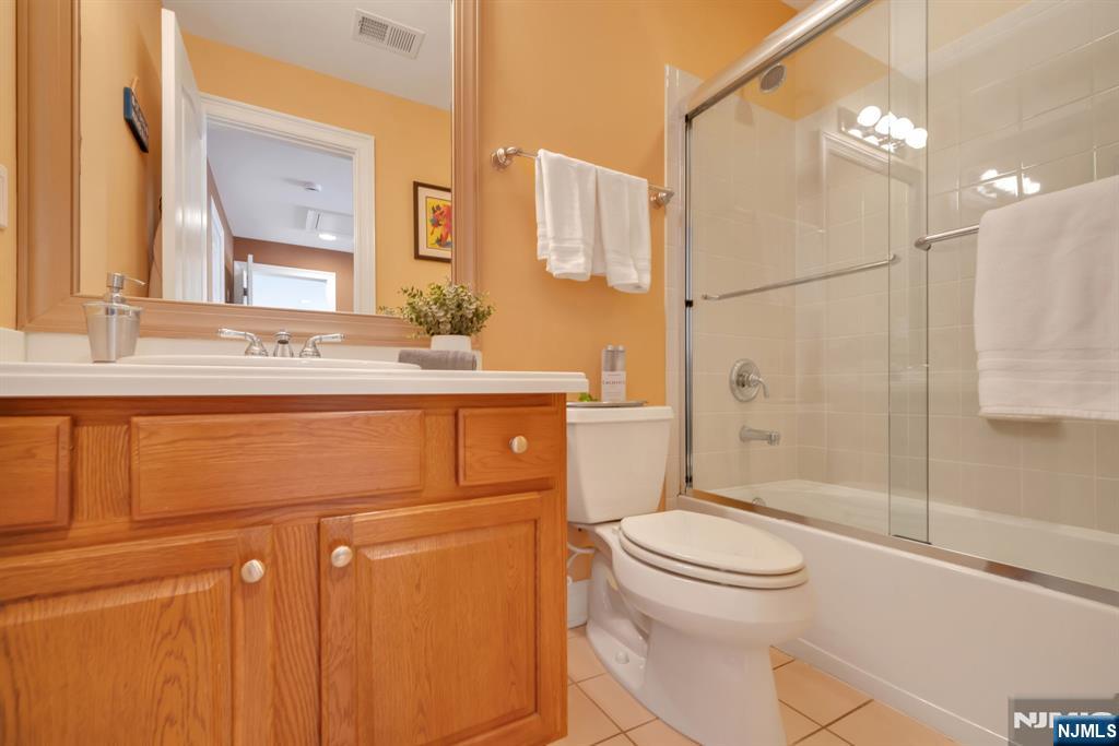 28 Arbor Road North Caldwell, NJ 07006 - Photo 38 of 50 a bathroom with a sink a toilet and shower