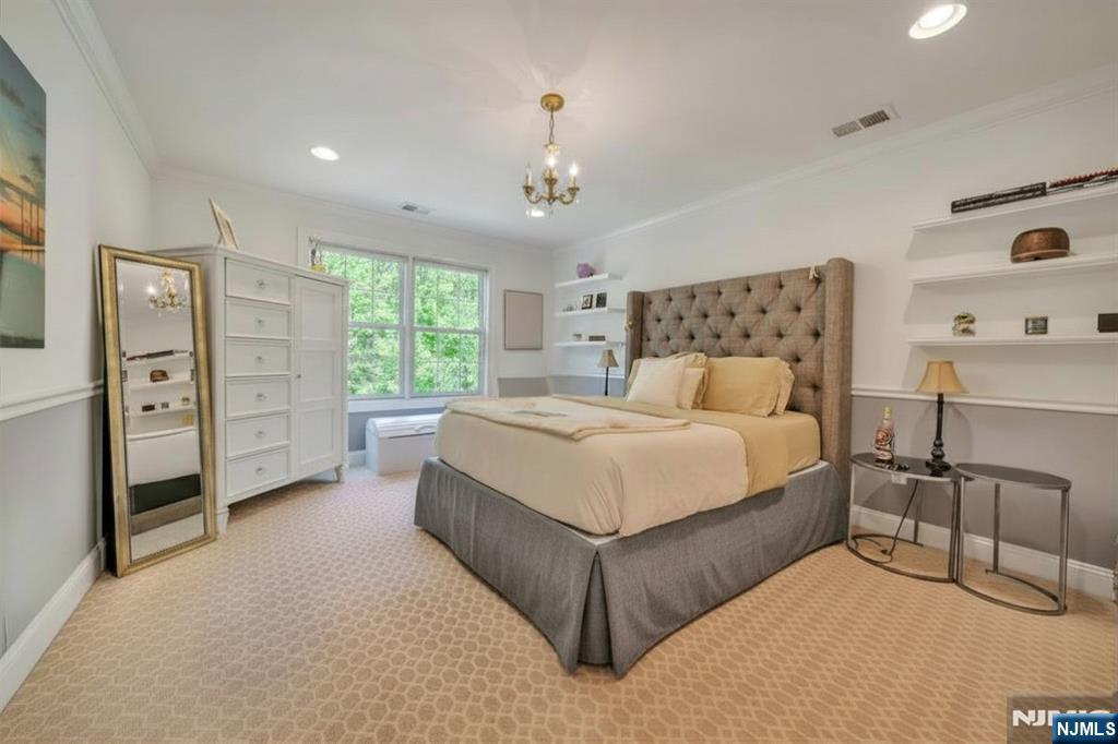 28 Arbor Road North Caldwell, NJ 07006 - Photo 39 of 50 a bedroom with a bed closet and window