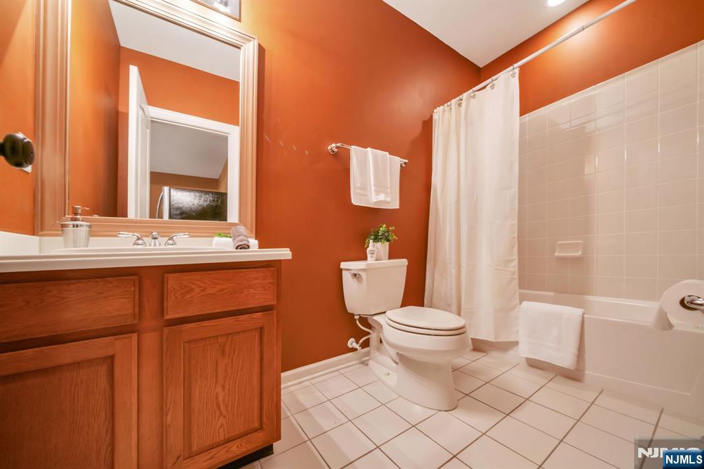 28 Arbor Road North Caldwell, NJ 07006 - Photo 47 of 50 a bathroom with a sink a toilet and mirror