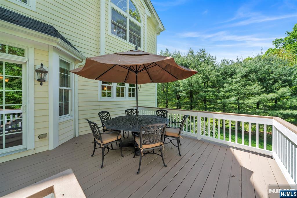 28 Arbor Road North Caldwell, NJ 07006 - Photo 48 of 50 a view of a chair and table on the deck