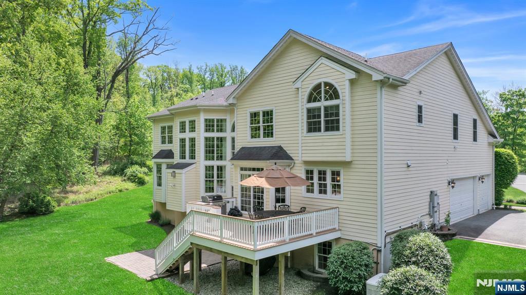 28 Arbor Road North Caldwell, NJ 07006 - Photo 49 of 50 a front view of a house with a yard
