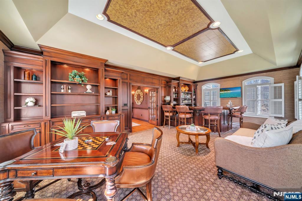 28 Arbor Road North Caldwell, NJ 07006 - Photo 6 of 50 a living room with furniture and a book shelf