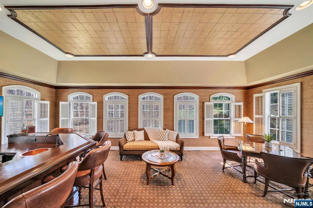 28 Arbor Road North Caldwell, NJ 07006 - Photo 8 of 50 a living room with furniture a fireplace and large windows