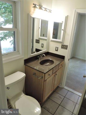 51 Windjammer Road Ocean Pines, MD 21811 - Photo 20 of 23 a bathroom with a sink a toilet and mirror