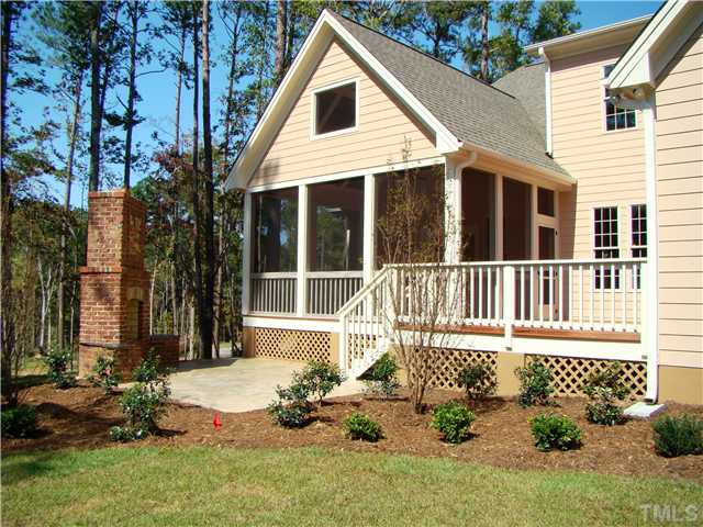 6305 Earle Ridge Lane Raleigh, NC 27606 - Photo 8 of 9 Beautifully landscaped yard w/ privacy fence, screen porch, deck, stamped patio, brick stone wood-burning fireplace & centipede sod! WOW! Exterior Back