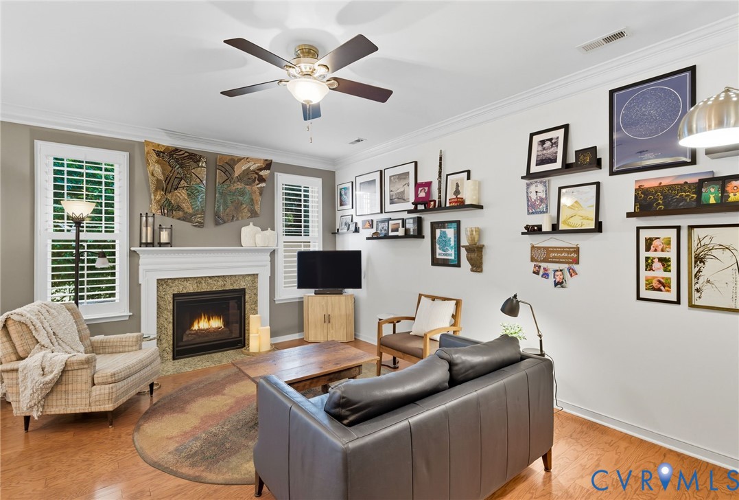 13712 Woodbridge Crossing Way Midlothian, VA 23112 - Photo 11 of 33 a living room with furniture and a fireplace
