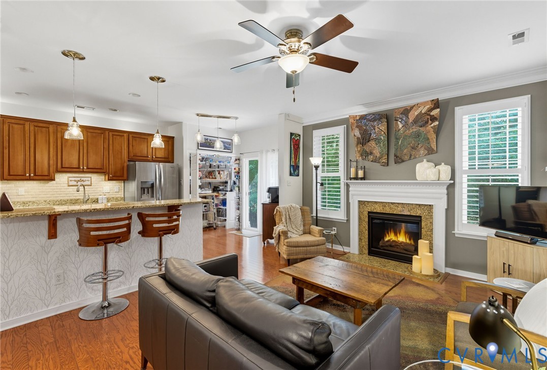 13712 Woodbridge Crossing Way Midlothian, VA 23112 - Photo 12 of 33 a living room with furniture and a fireplace