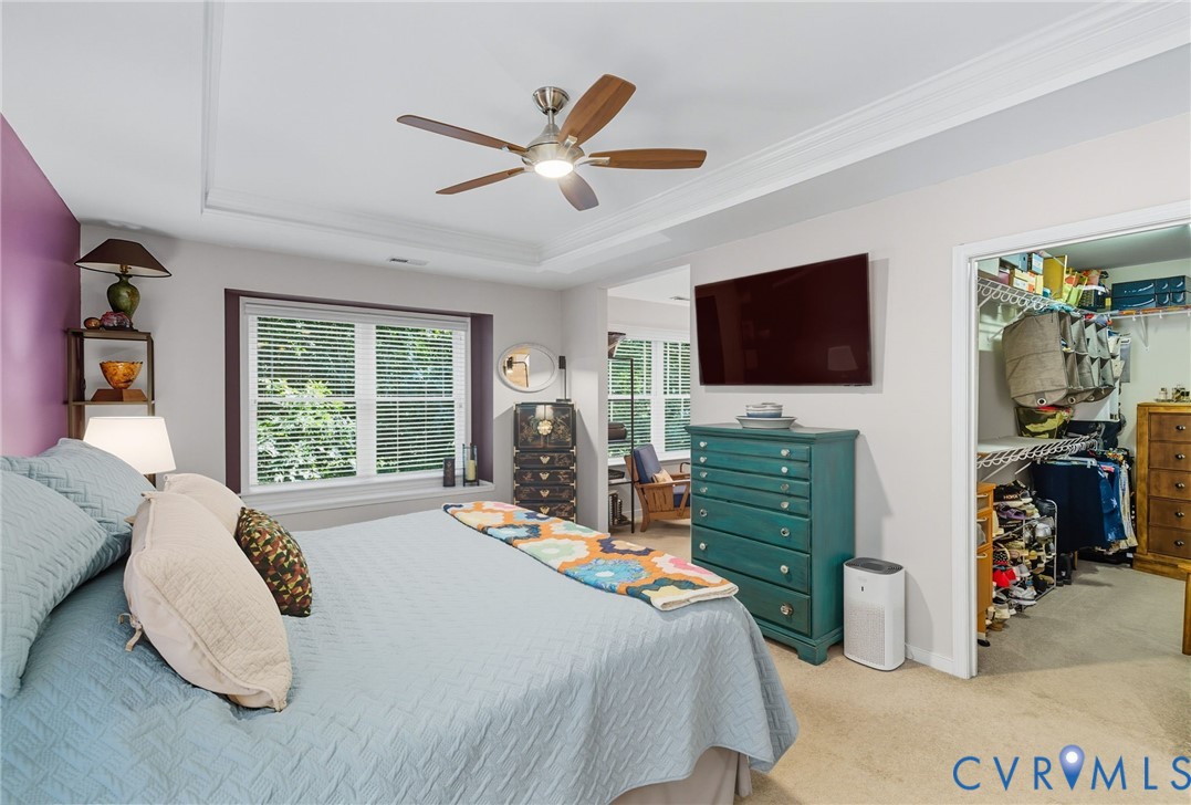 13712 Woodbridge Crossing Way Midlothian, VA 23112 - Photo 14 of 33 a bedroom with a bed a flat screen tv and a large window