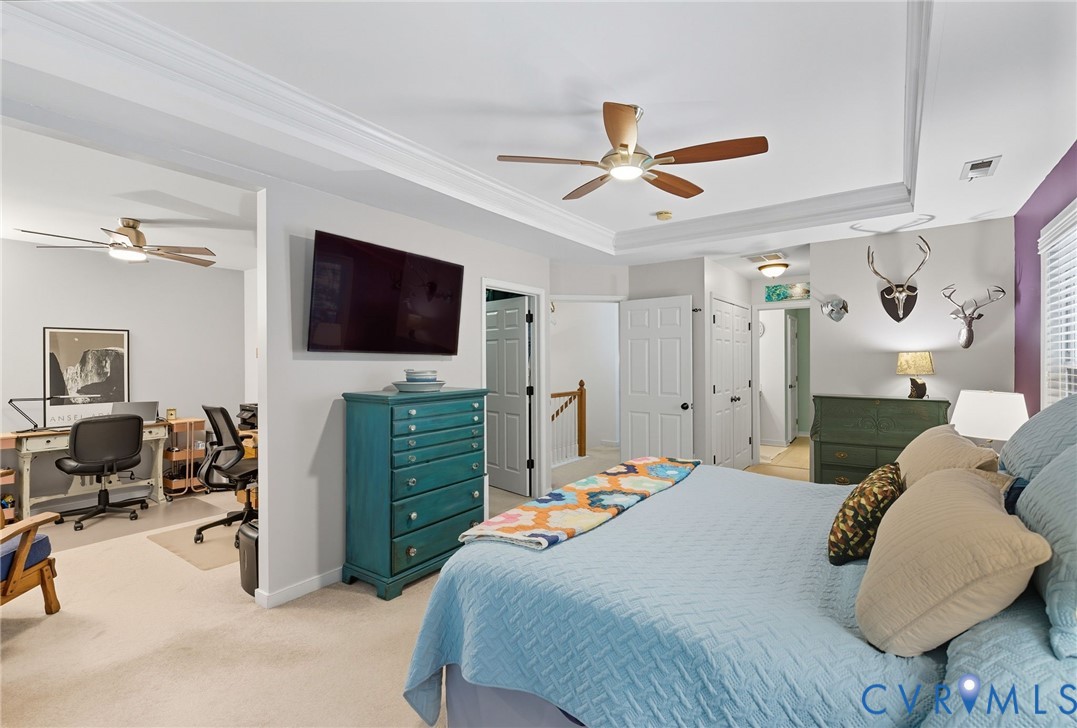 13712 Woodbridge Crossing Way Midlothian, VA 23112 - Photo 15 of 33 a bedroom with a bed and a flat screen tv