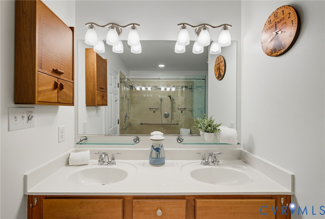 13712 Woodbridge Crossing Way Midlothian, VA 23112 - Photo 16 of 33 a bathroom with a sink and a mirror