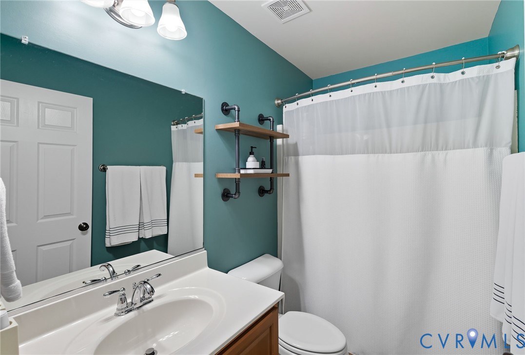 13712 Woodbridge Crossing Way Midlothian, VA 23112 - Photo 20 of 33 a bathroom with a sink and toilet