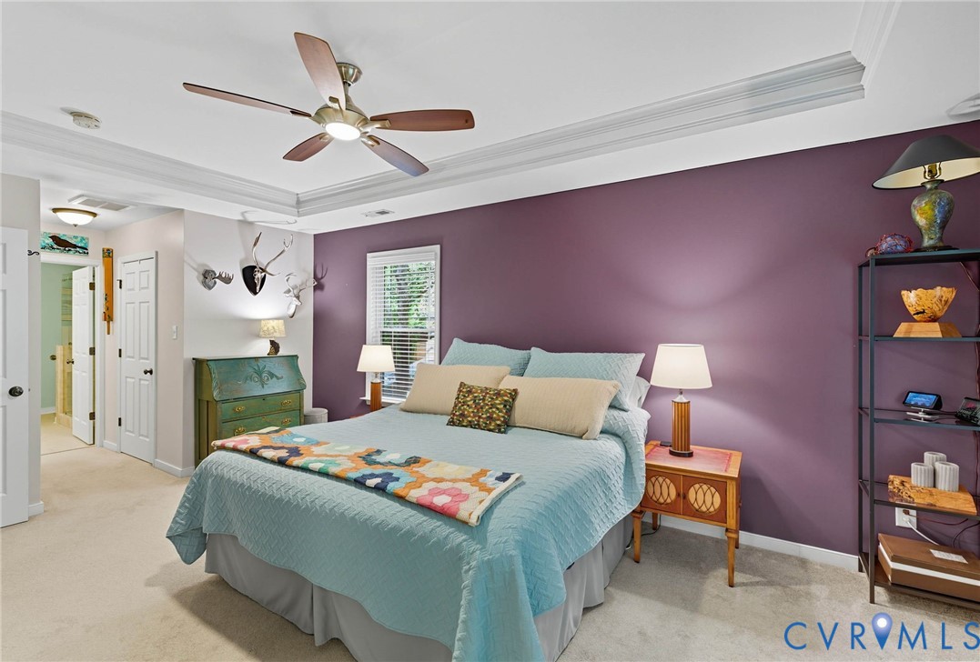 13712 Woodbridge Crossing Way Midlothian, VA 23112 - Photo 21 of 33 a bedroom with a bed and a chandelier