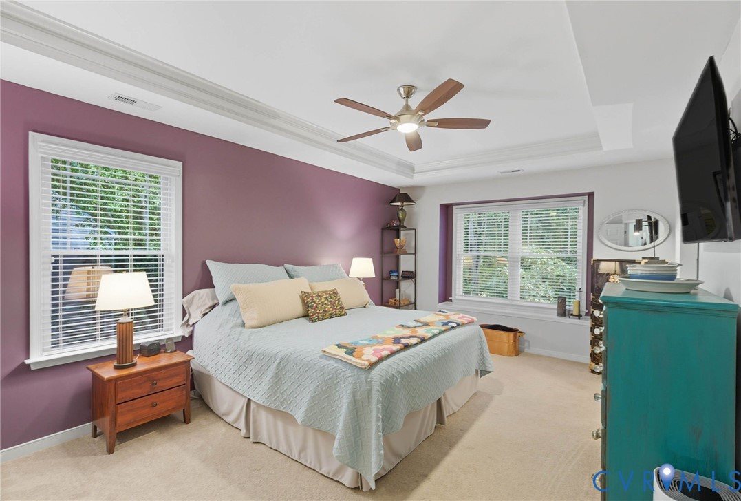 13712 Woodbridge Crossing Way Midlothian, VA 23112 - Photo 22 of 33 a bedroom with a bed a window and a flat screen television