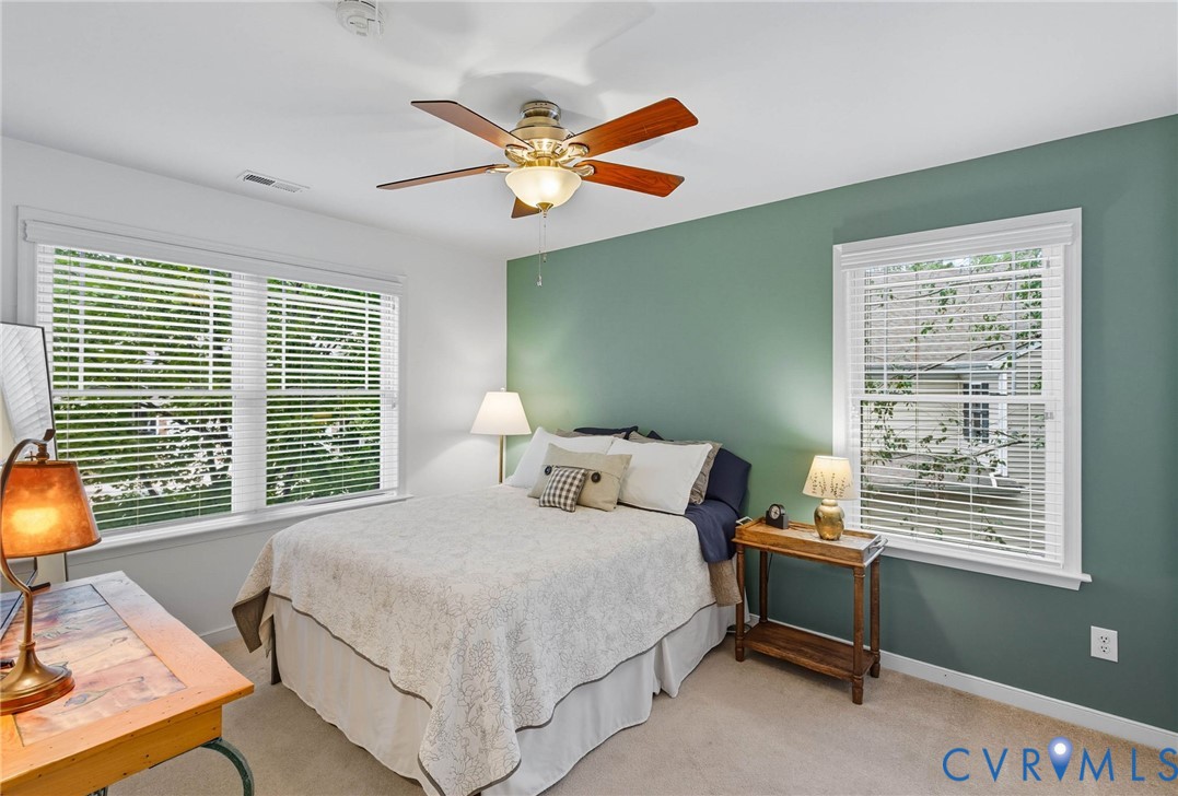 13712 Woodbridge Crossing Way Midlothian, VA 23112 - Photo 25 of 33 a bedroom with a bed and a window