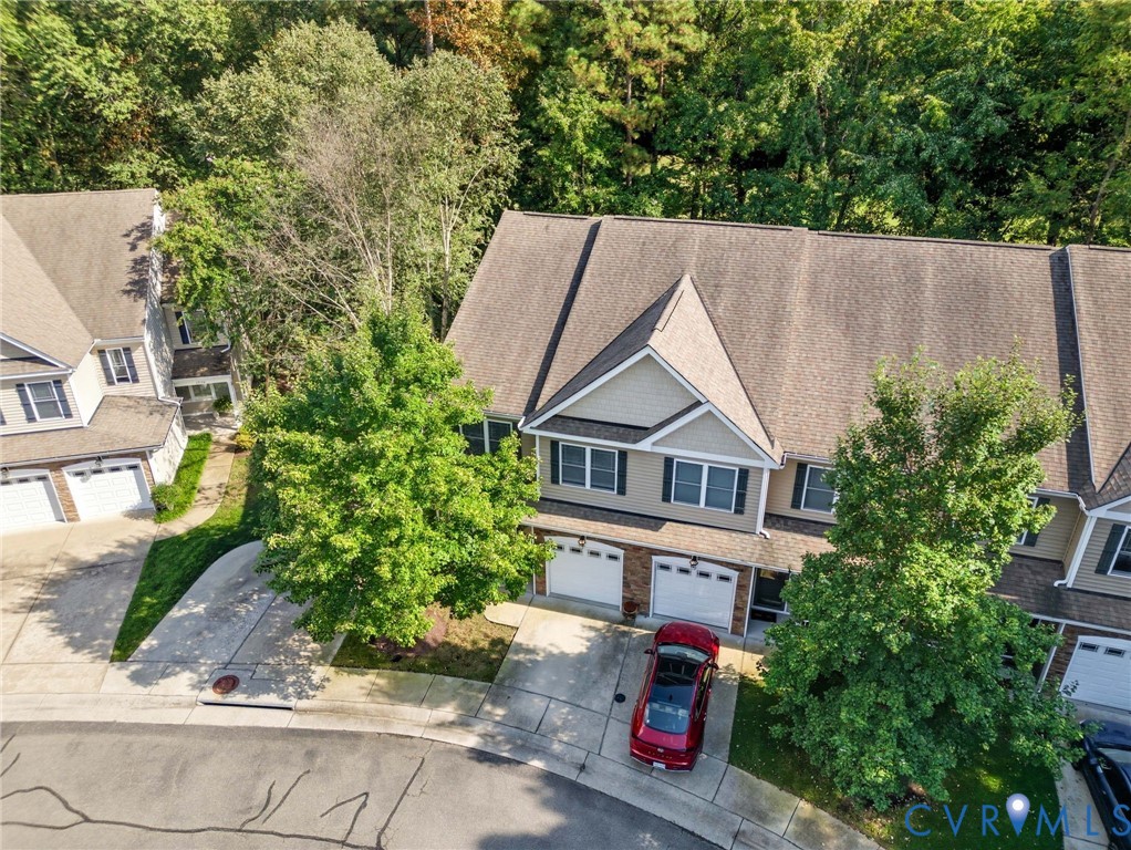 13712 Woodbridge Crossing Way Midlothian, VA 23112 - Photo 32 of 33 an aerial view of a house with a yard and large trees