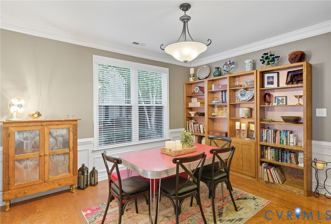 13712 Woodbridge Crossing Way Midlothian, VA 23112 - Photo 5 of 33 a view of a dining room with furniture and a window