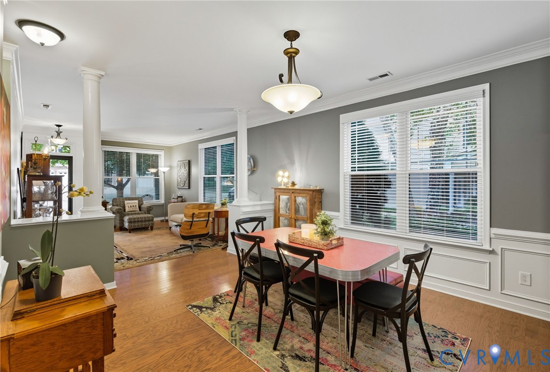 13712 Woodbridge Crossing Way Midlothian, VA 23112 - Photo 6 of 33 a view of a dining room with furniture and a large window