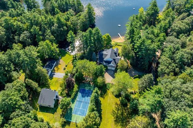 an aerial view of a house with a yard and garden