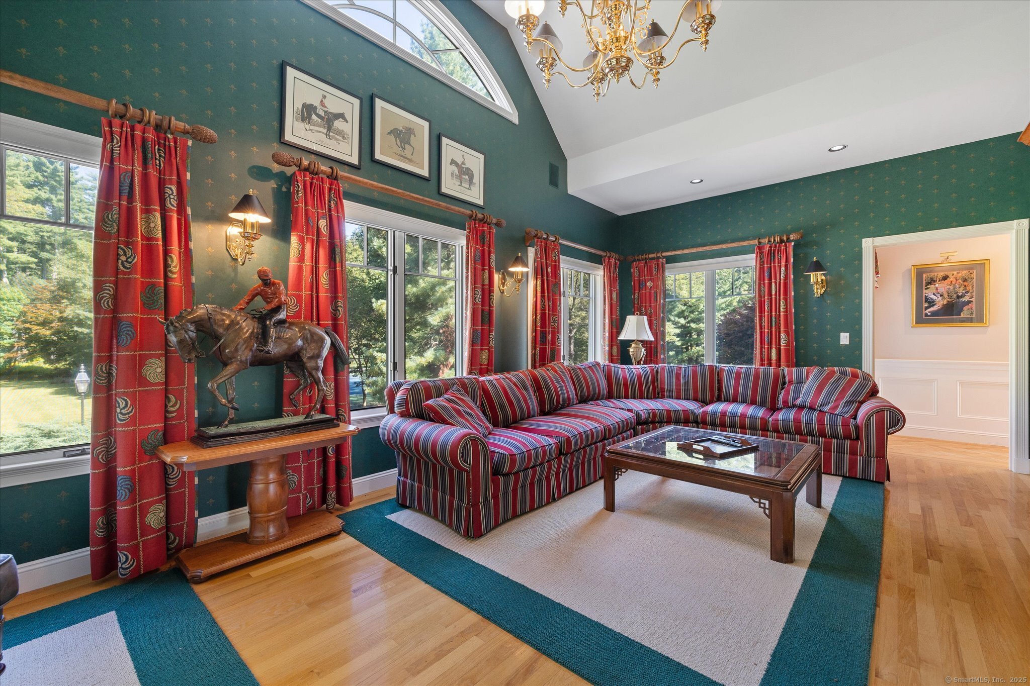 21-40 Howard Road Union, CT 06076 - Photo 11 of 40 a living room with furniture a large window and a flat screen tv