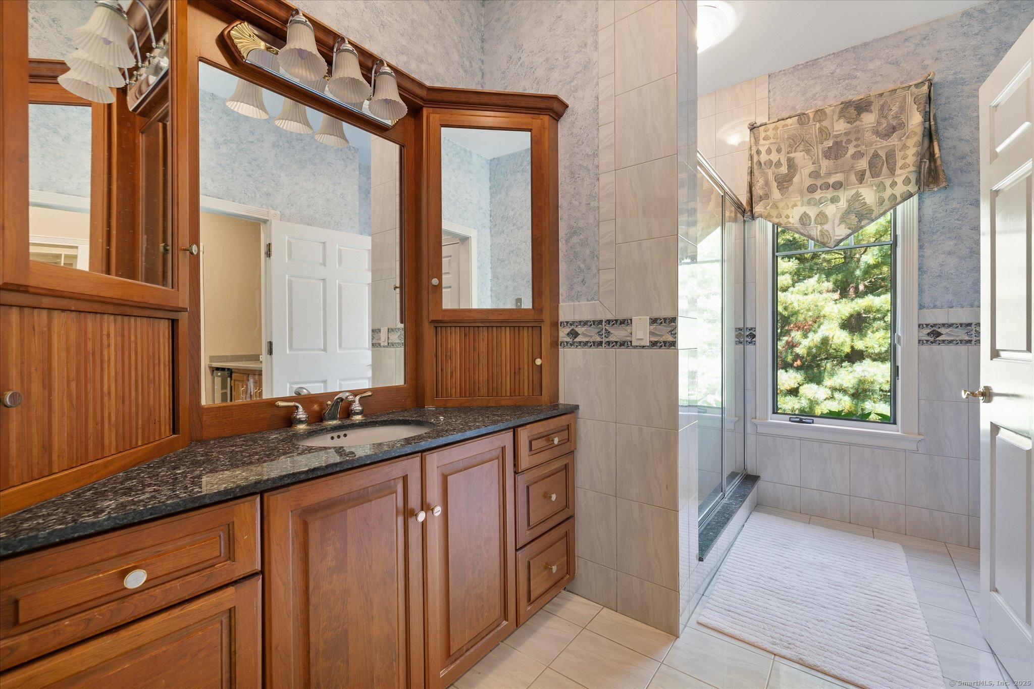 21-40 Howard Road Union, CT 06076 - Photo 15 of 40 a bathroom with a granite countertop sink and a mirror