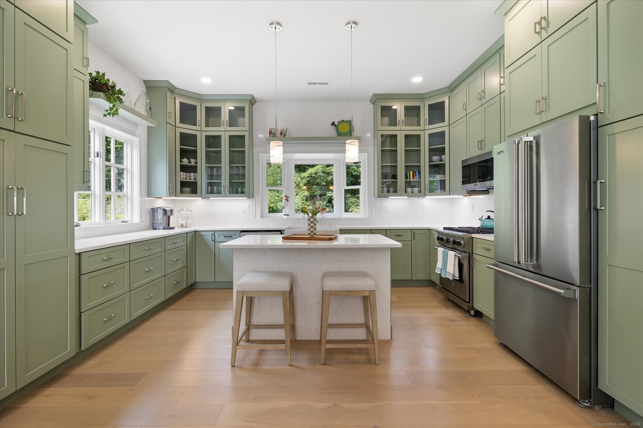 21-40 Howard Road Union, CT 06076 - Photo 23 of 40 a kitchen with refrigerator a sink and chairs