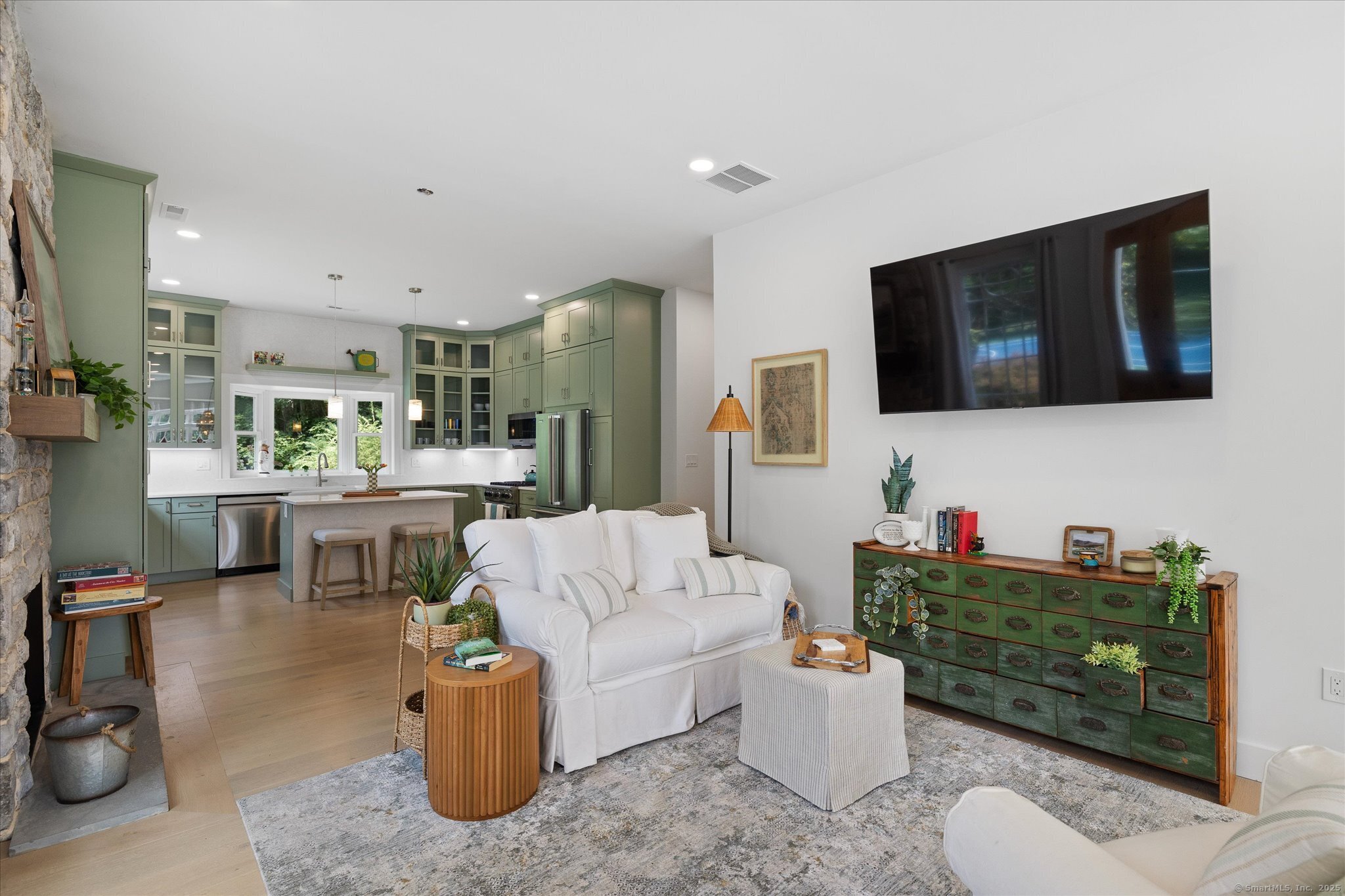 21-40 Howard Road Union, CT 06076 - Photo 25 of 40 a living room with furniture and a flat screen tv