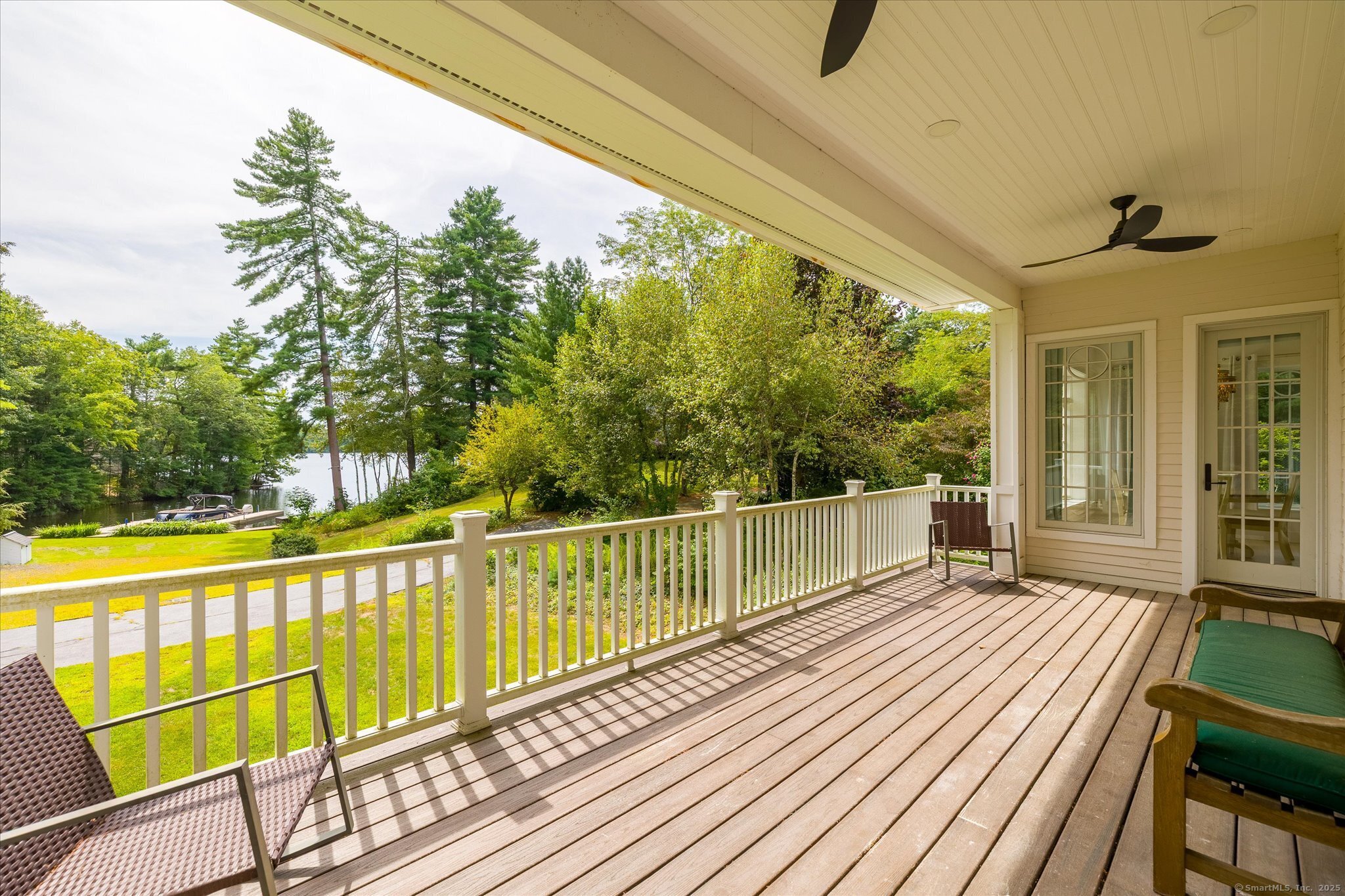 21-40 Howard Road Union, CT 06076 - Photo 26 of 40 a view of a balcony with wooden floor next to a yard