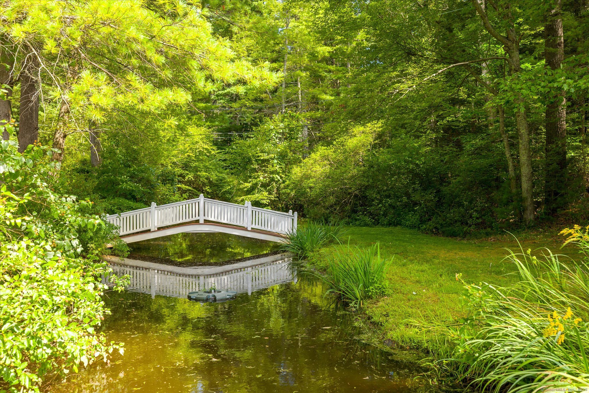 21-40 Howard Road Union, CT 06076 - Photo 32 of 40 a backyard of a house with yard and outdoor seating