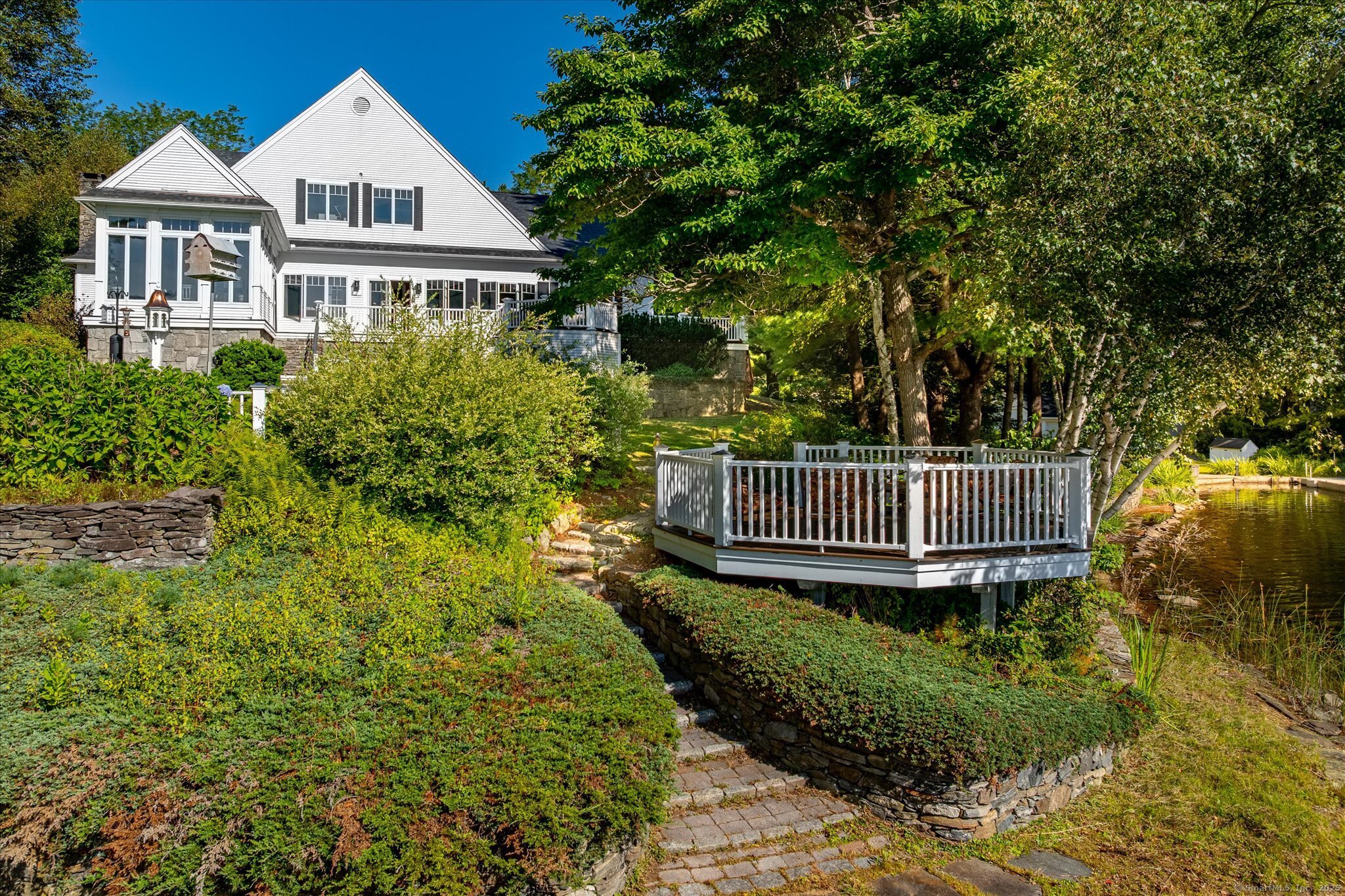 21-40 Howard Road Union, CT 06076 - Photo 36 of 40 a view of a house with a small yard and wooden fence