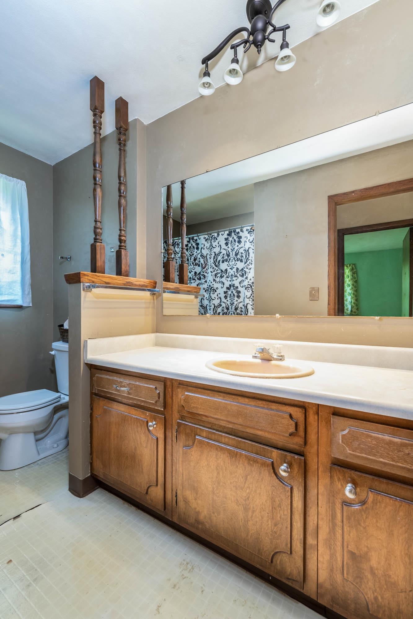 545 Baintree Road Lake Summerset, IL 61019 - Photo 16 of 28 a bathroom with a sink a toilet and mirror