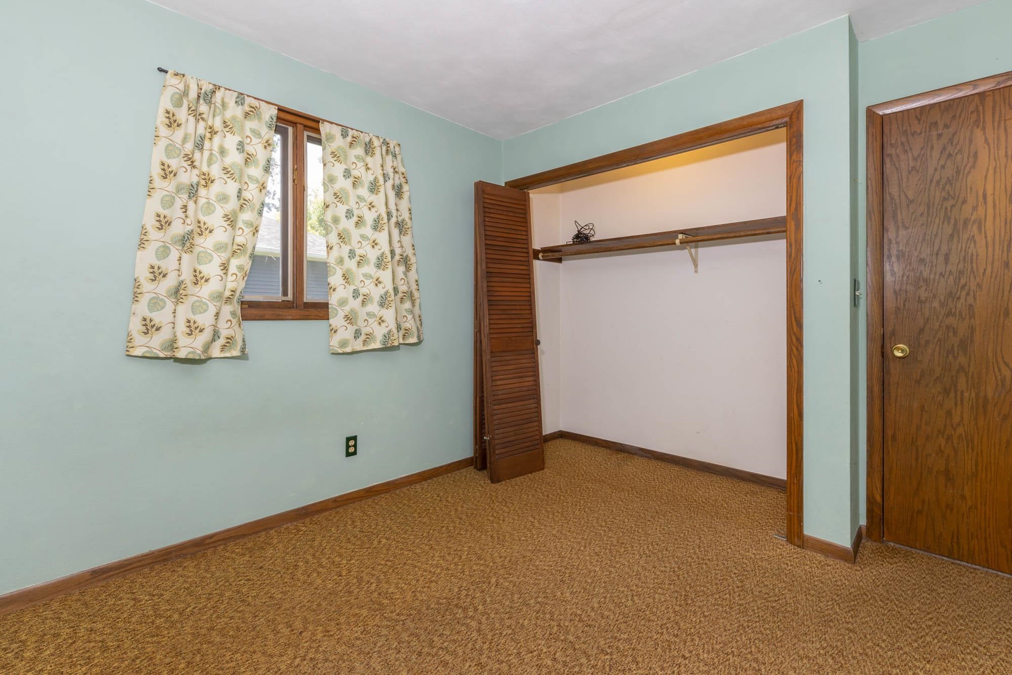 545 Baintree Road Lake Summerset, IL 61019 - Photo 19 of 28 an empty room with windows and closet