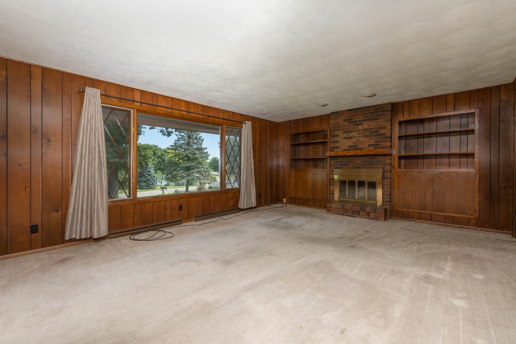 545 Baintree Road Lake Summerset, IL 61019 - Photo 5 of 28 a view of empty room with a fireplace and window