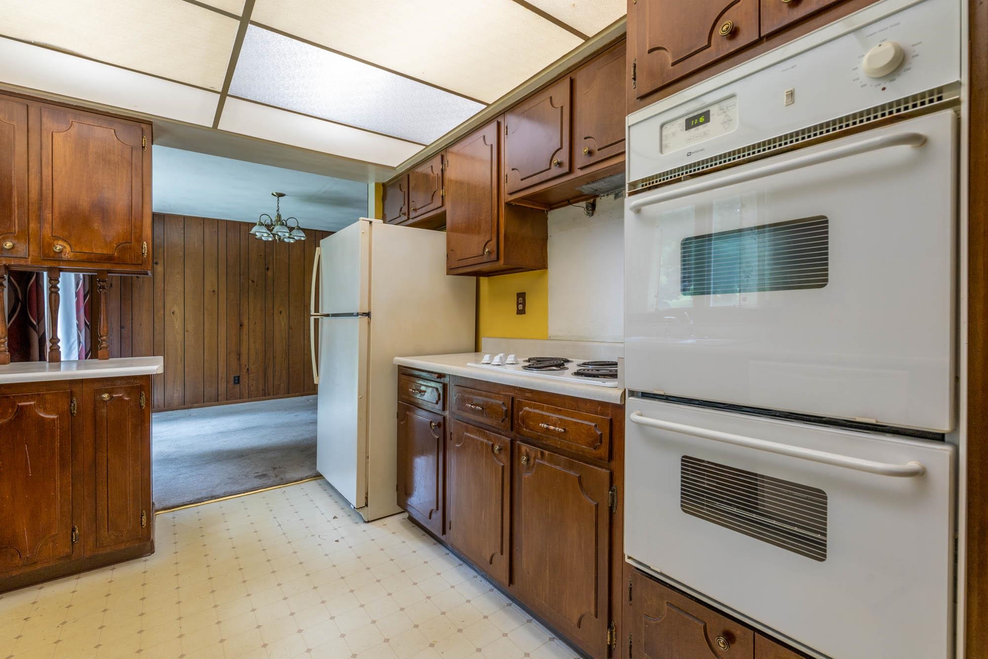 545 Baintree Road Lake Summerset, IL 61019 - Photo 10 of 28 a kitchen with stainless steel appliances granite countertop a refrigerator and a stove