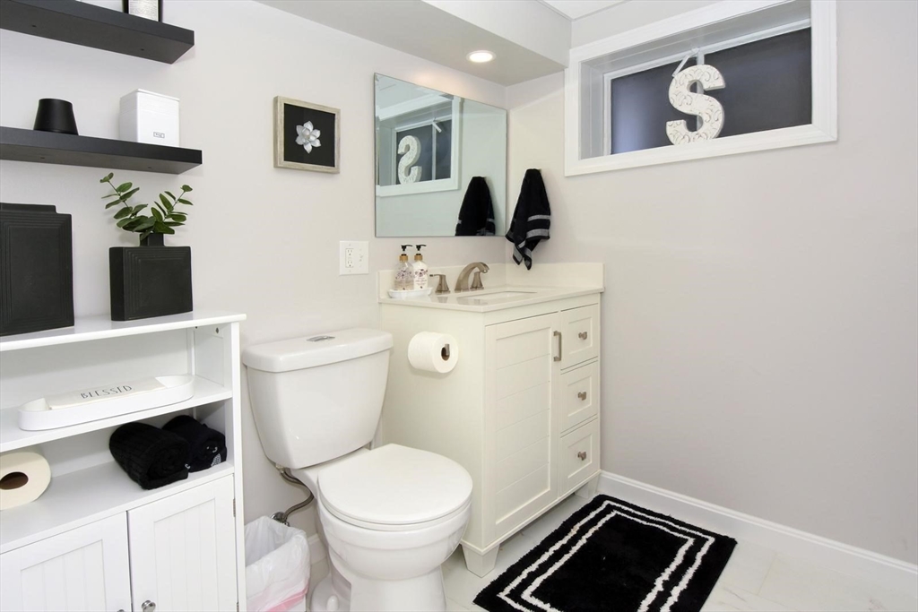 7 Erhardt Terrace Methuen, MA 01844 - Photo 13 of 24 a bathroom with a toilet sink and mirror