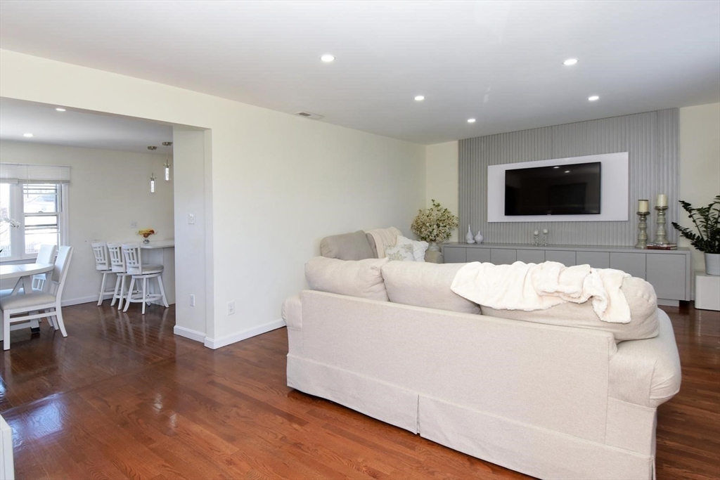7 Erhardt Terrace Methuen, MA 01844 - Photo 16 of 24 a living room with furniture and a flat screen tv