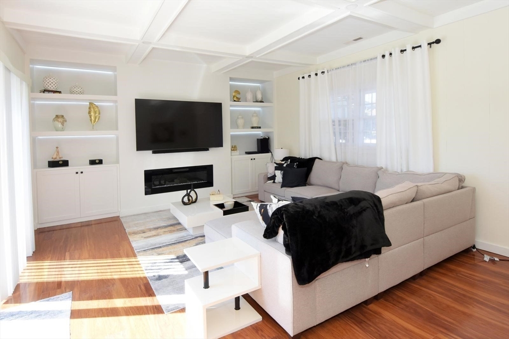 7 Erhardt Terrace Methuen, MA 01844 - Photo 2 of 24 a living room with furniture and a flat screen tv