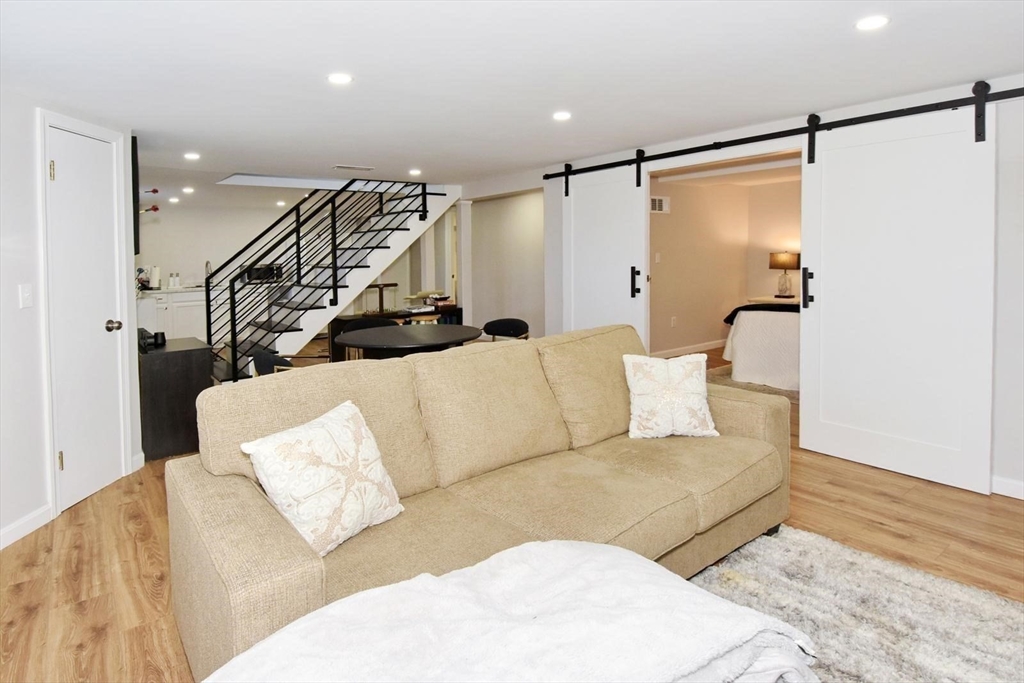 7 Erhardt Terrace Methuen, MA 01844 - Photo 4 of 24 a living room with furniture and a rug