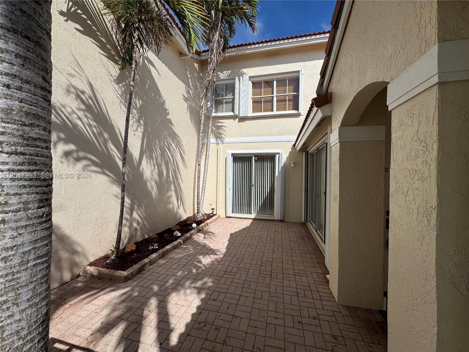 1595 Seagrape Way Hollywood, FL 33019 - Photo 10 of 39 Entry through Private Courtyard