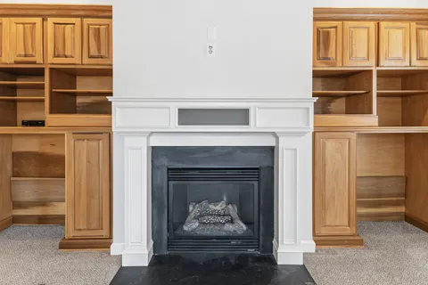 a living room with a fireplace