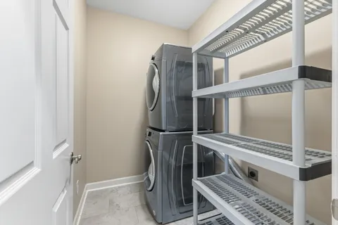 a kitchen with a refrigerator and a stove