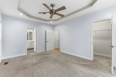 a view of an empty room with a ceiling fan