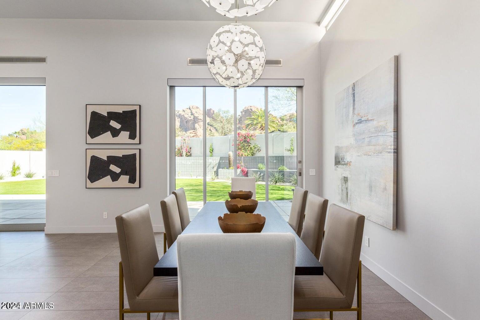 5833 North 46th Street Phoenix, AZ 85018 - Photo 8 of 29 a dining room with furniture and a window
