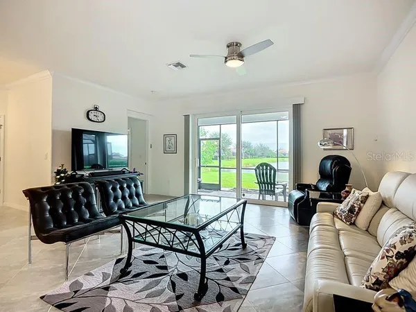 a living room with furniture and a large window