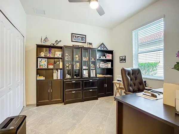 a workspace with furniture and window