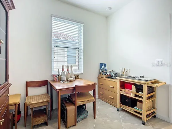 a bedroom with a bed and a desk